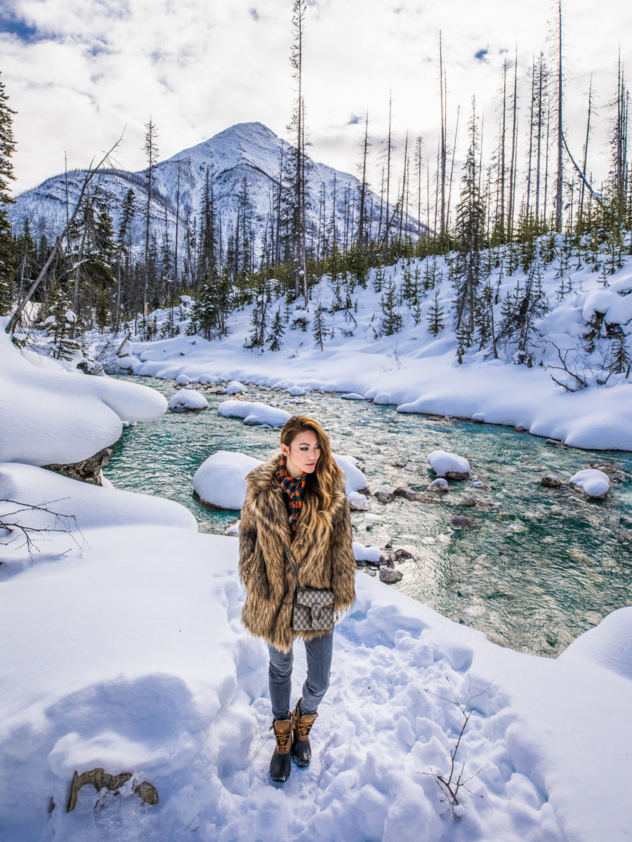 Banff Travel Guide - Brown Fur Coat with Ski Boots and Plaid Scarf // Notjessfashion.com