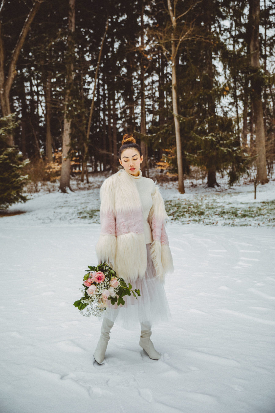 Dressy Winter Outfits - White and Pink Fur Coat with Tulle Skirt and White Sweater // Notjessfashion.com // elegant winter outfit, dressy outfits for the snow, snow outfit, tulle midi skirt, white boots, winter white outfit, asian blogger, new york fashion blogger, winter fashion editorial