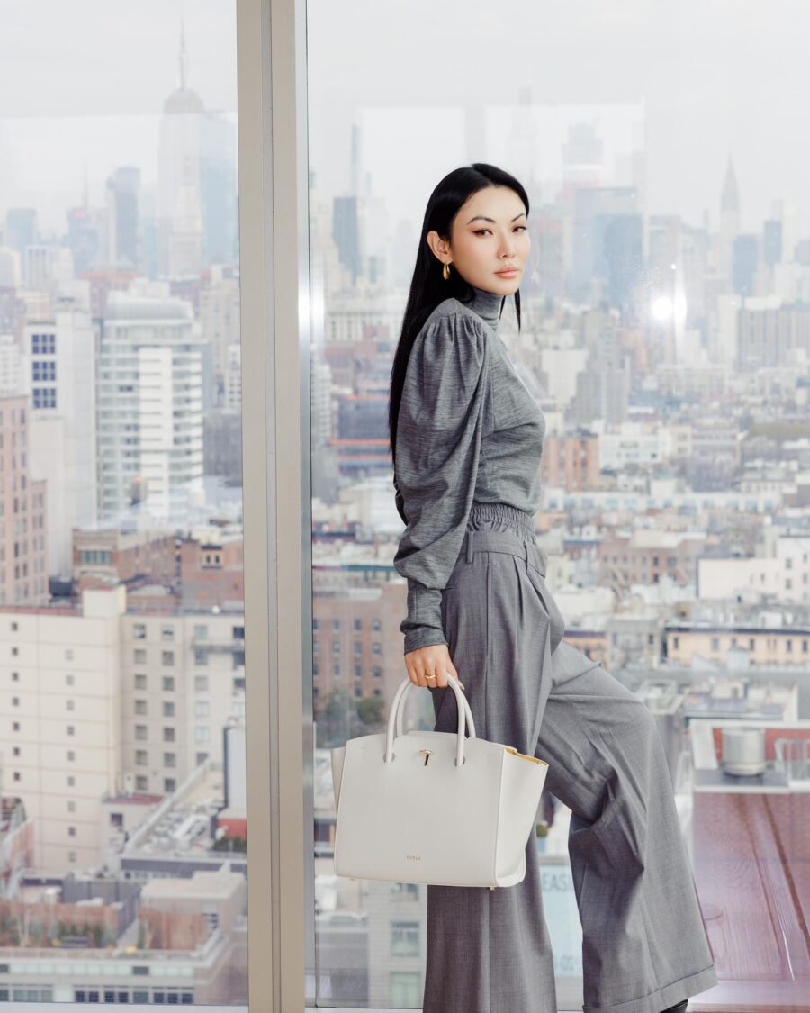 Jessica Wang wearing a grey turtleneck sweater with trousers while sharing winter work outfits // Jessica Wang - JessicaWang.com