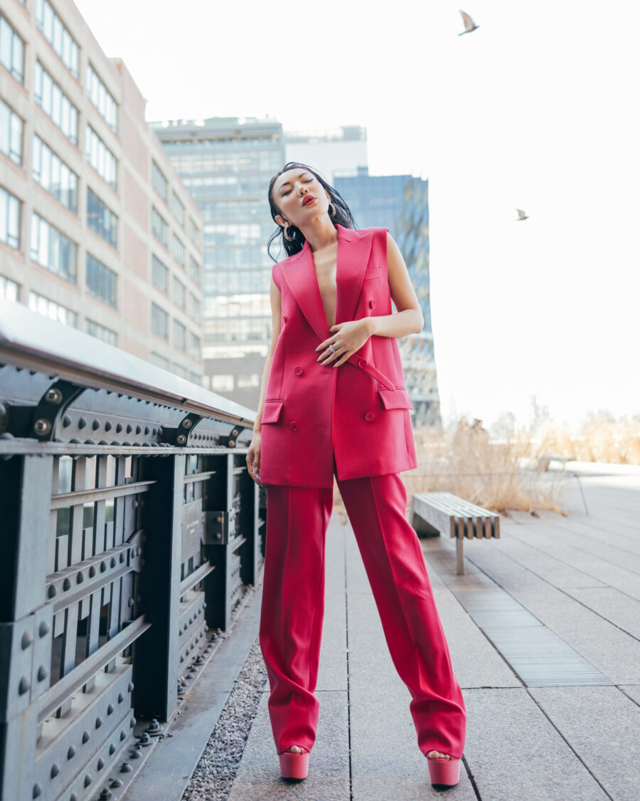 jessica wang wearing a pink vest and trousers