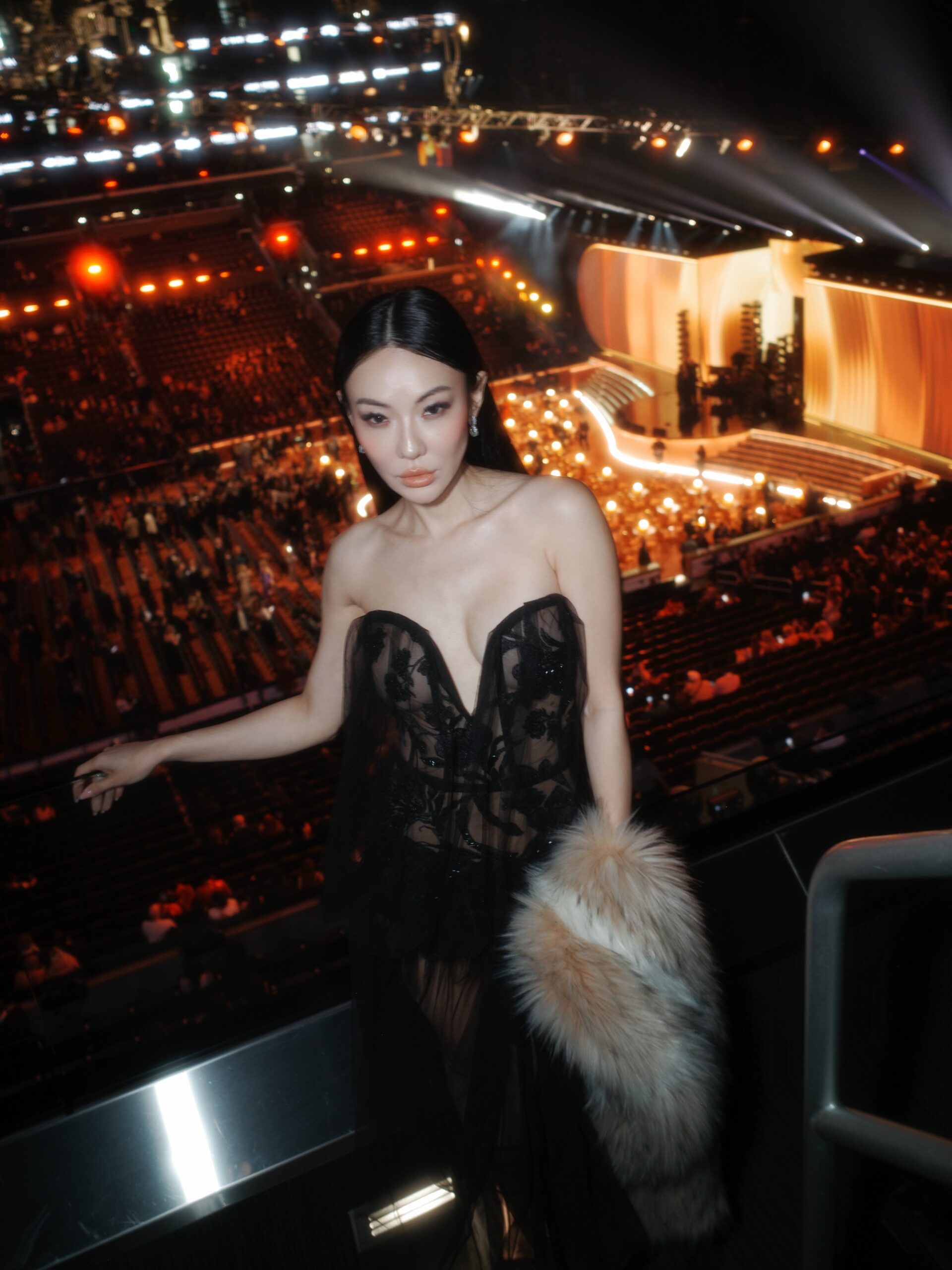 Jessica Wang wearing a black floral-lace corset dress at an evening event