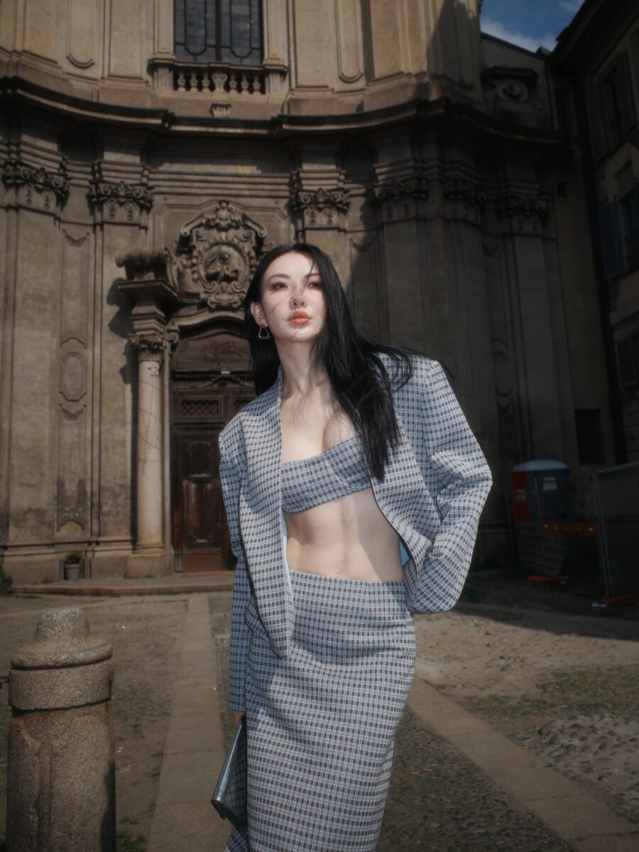 Jessica Wang in a gray layered look, illustrating the structured styling that makes jazz shoes feel intentional