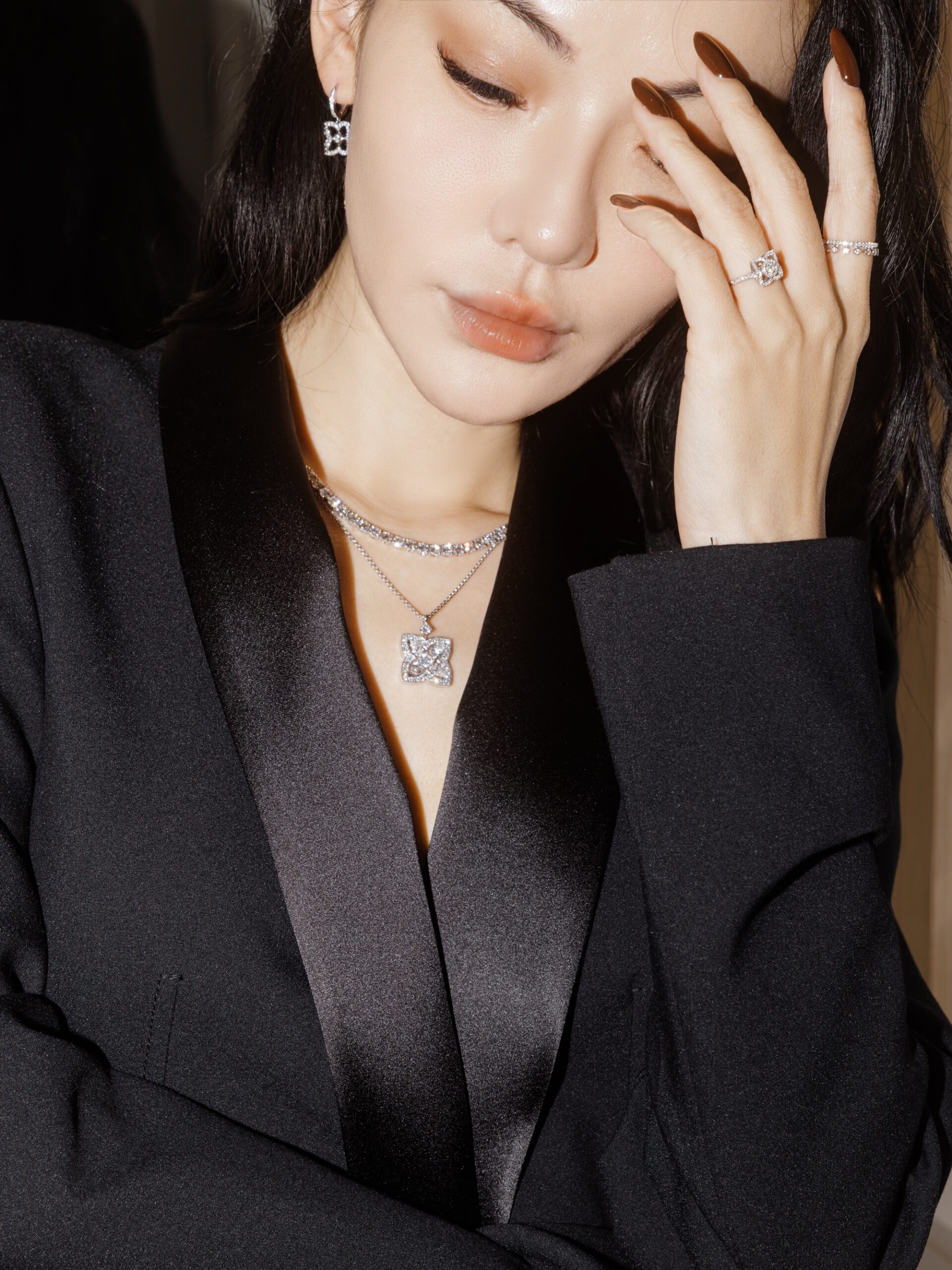 Close portrait of Jessica Wang with softly defined eyeliner and neutral makeup